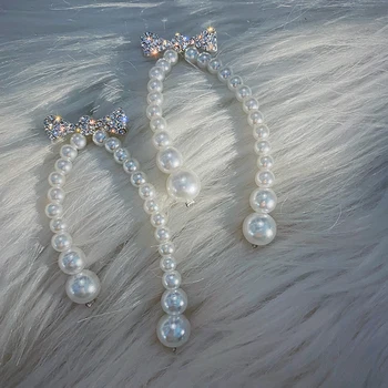 Perdėtai ilgos, baltos, perlų bowknot kristalų temperamento moteris auskarai 2020 korėjos naujo dizaino mados juvelyrika