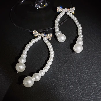 Perdėtai ilgos, baltos, perlų bowknot kristalų temperamento moteris auskarai 2020 korėjos naujo dizaino mados juvelyrika
